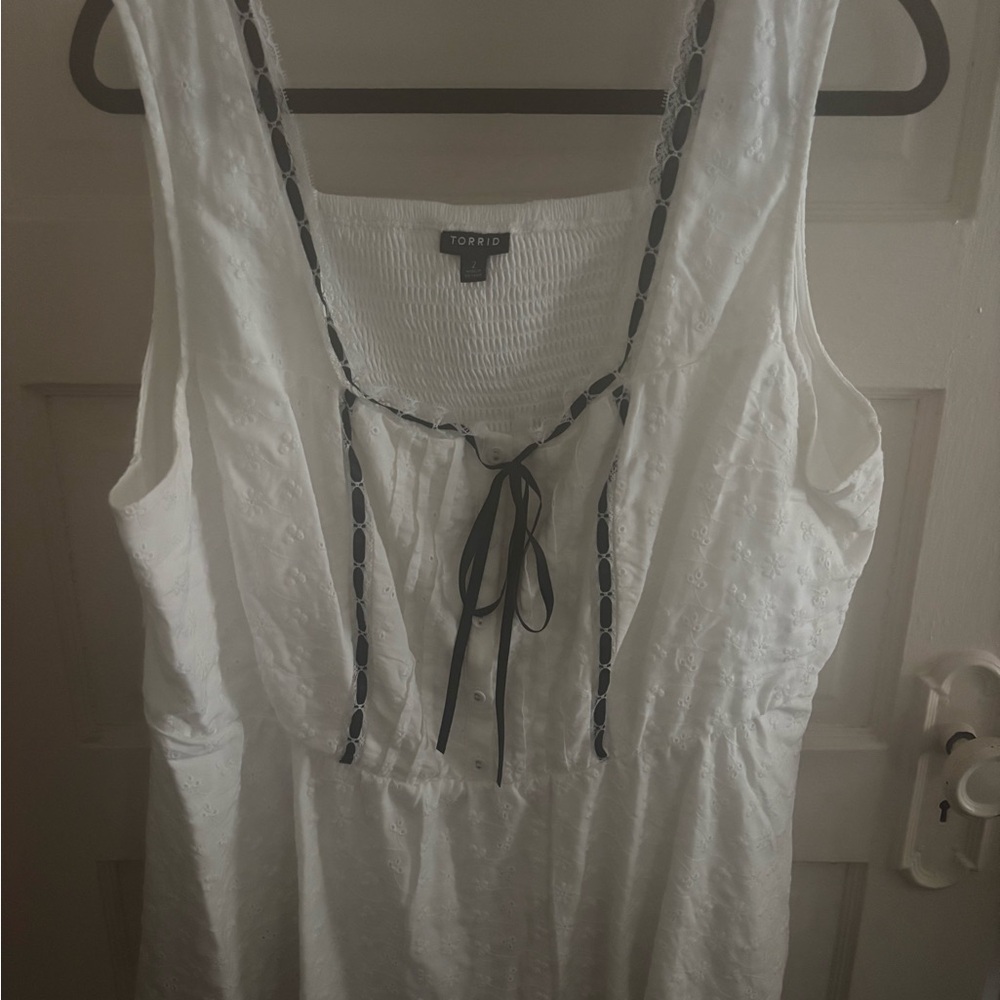 Torrid eyelet peplum top 
Never worn new without tag